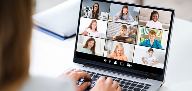 image of teacher on video chat with students